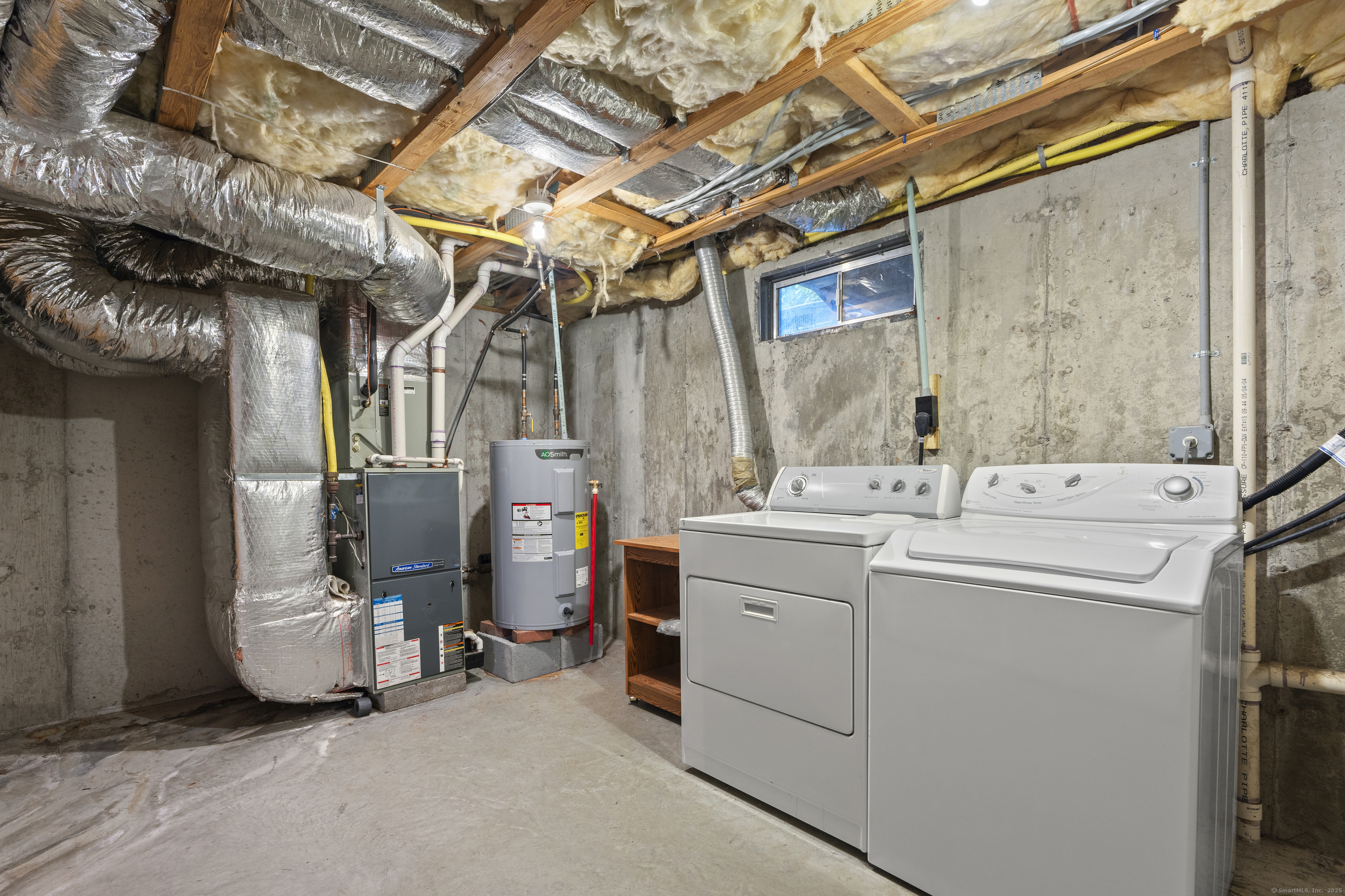 527 West Thames Street, Unit 9 Norwich, CT 06360 - Photo 23 of 25 a utility room with dryer and washer
