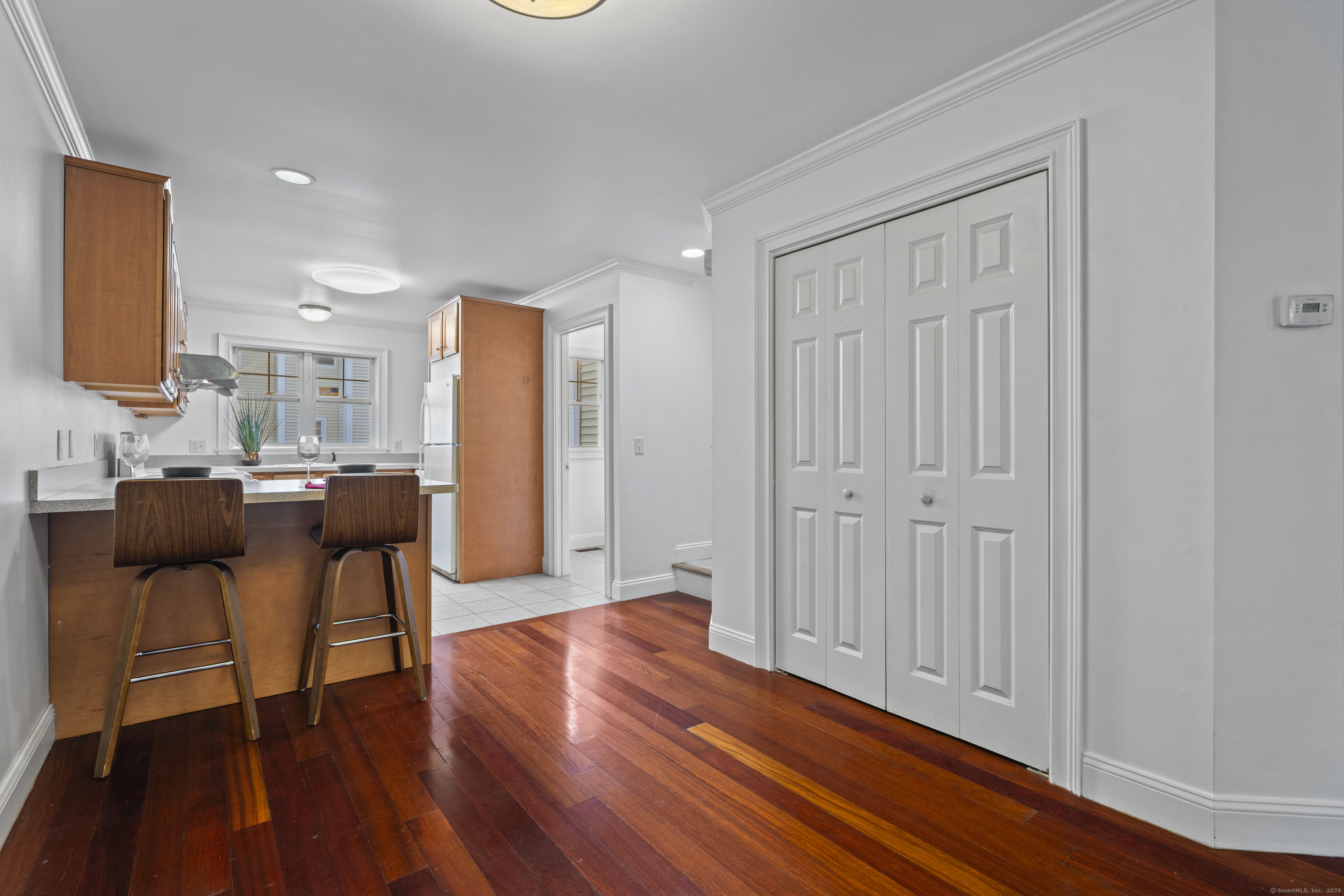 527 West Thames Street, Unit 9 Norwich, CT 06360 - Photo 6 of 25 a living room with furniture and a wooden floor