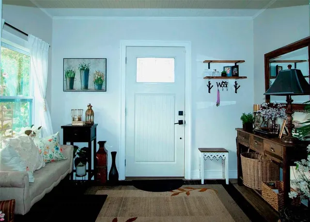 a bedroom with furniture and a window