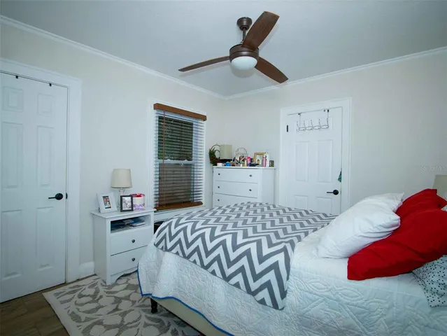 a bedroom with a bed and dresser