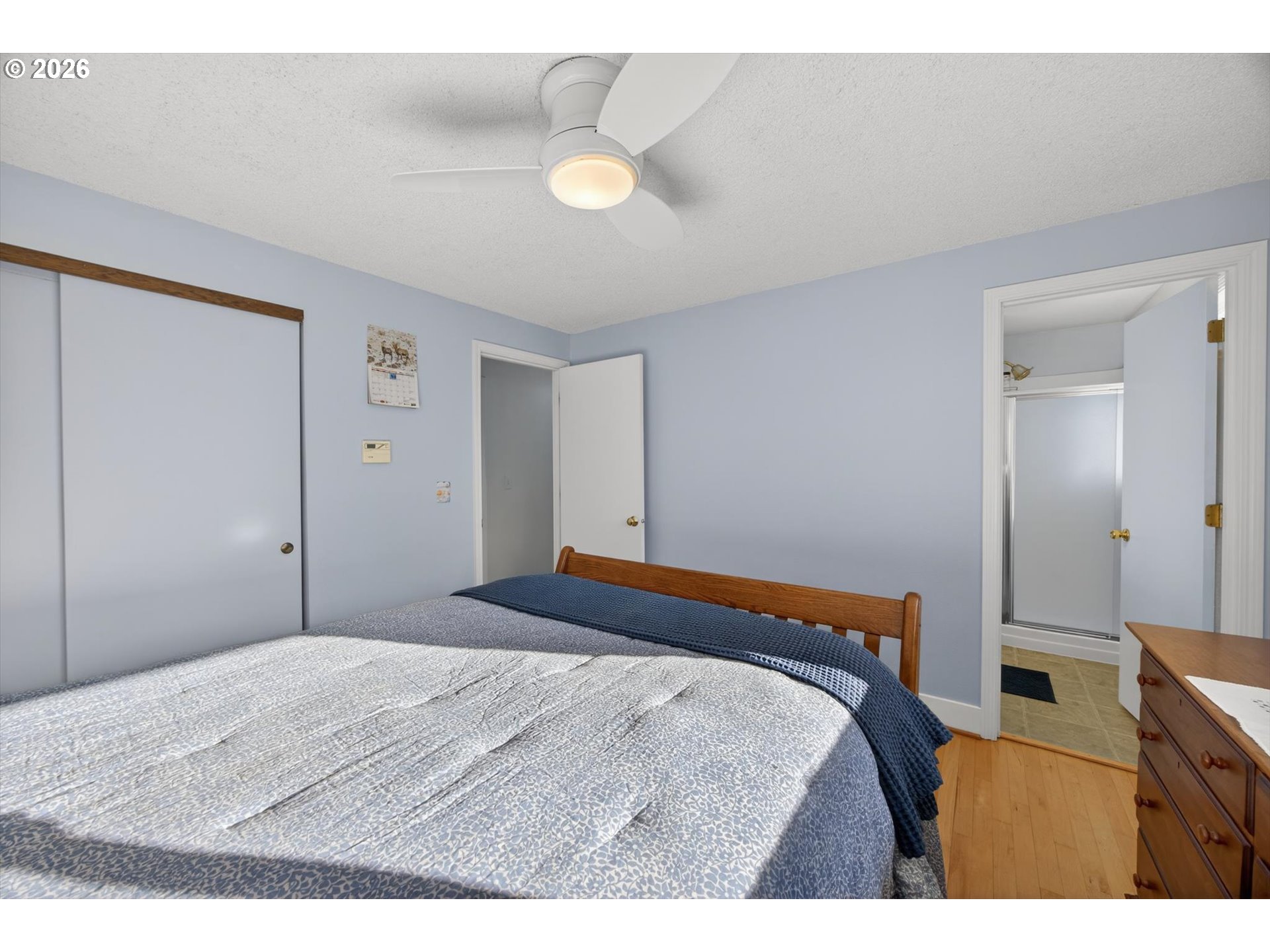 13601 South Union Hall Road Canby, OR 97013 - Photo 24 of 48 a bedroom with a bed and a cabinets