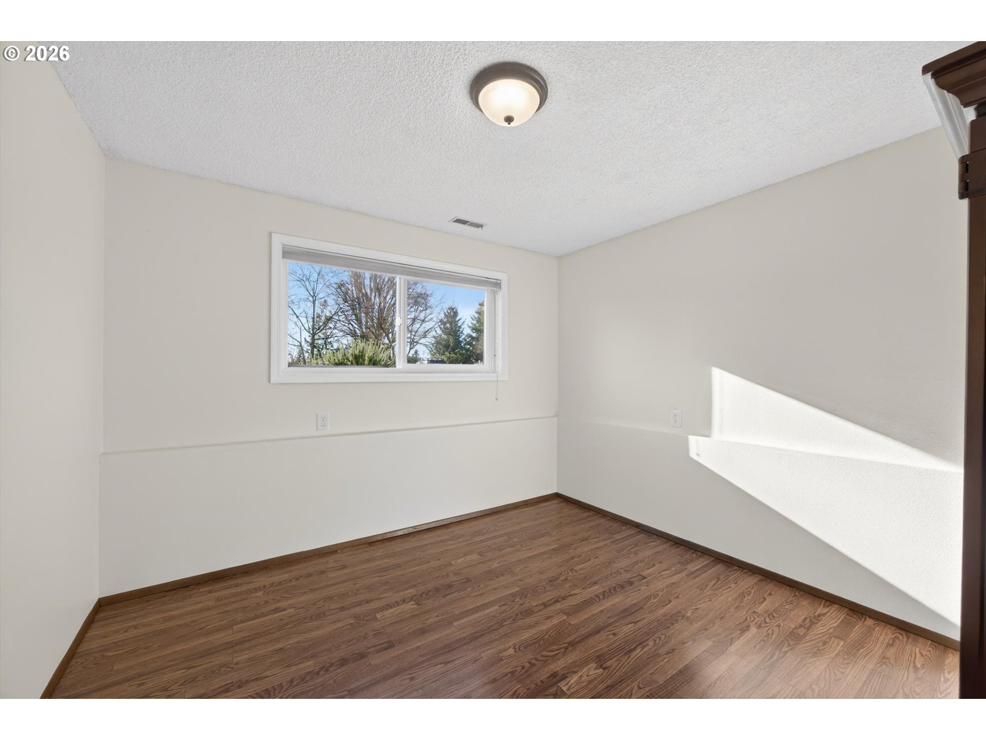 13601 South Union Hall Road Canby, OR 97013 - Photo 30 of 48 a view of an empty room with wooden floor