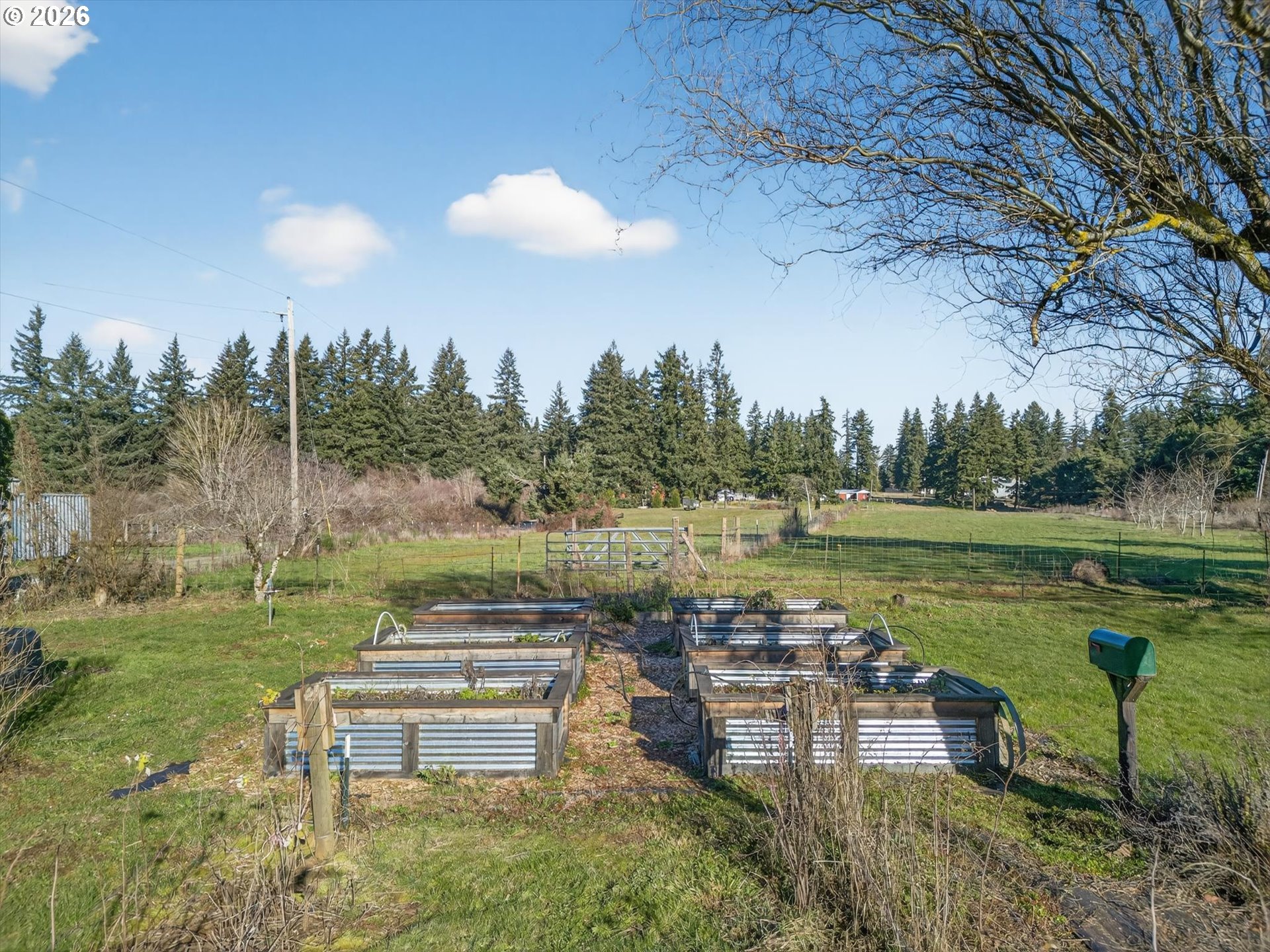 13601 South Union Hall Road Canby, OR 97013 - Photo 38 of 48 a view of a lake with a yard and a table