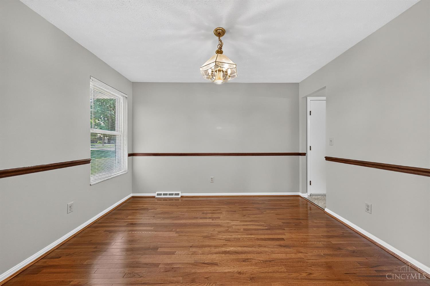 2086 Resor Road Fairfield, OH 45014 - Photo 10 of 42 Separate dining area with hardwood floors and classic chair-rail detail.