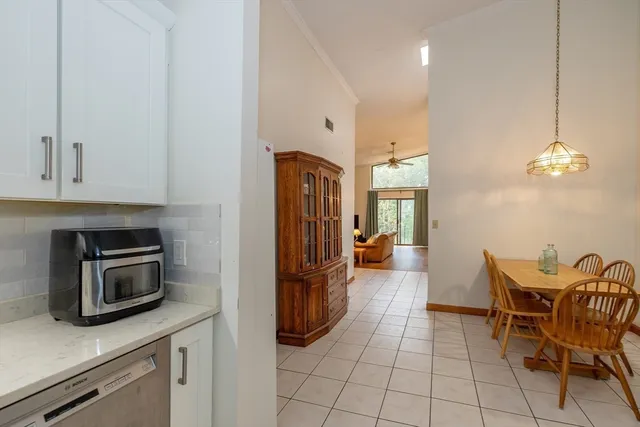 a kitchen with stainless steel appliances granite countertop a sink and a refrigerator
