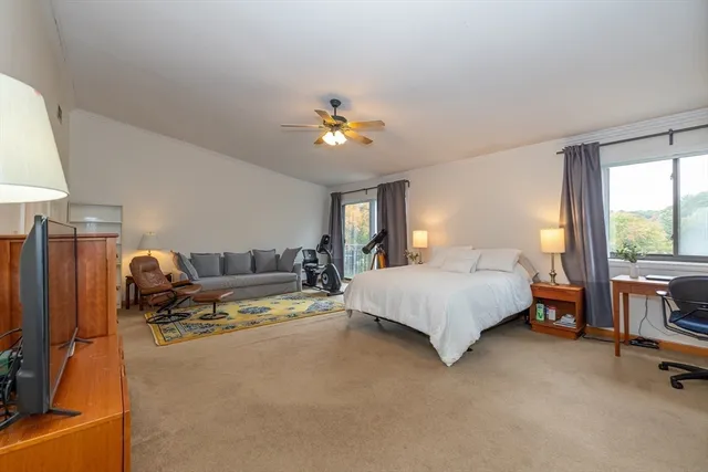 a bed room with a bed and a chandelier