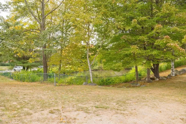 a backyard of a house with lots of green space