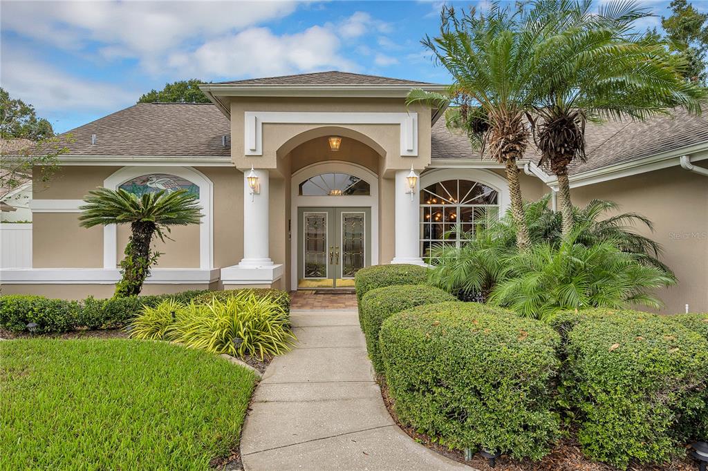 7421 Rawson Court Trinity, FL 34655 - Photo 1 of 1 a front view of a house with a garden
