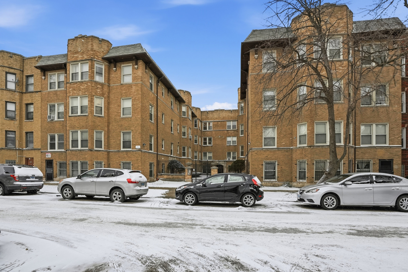 2212 East 70th Street, Unit 1B Chicago, IL 60649 - Photo 2 of 20 a car parked in front of a building