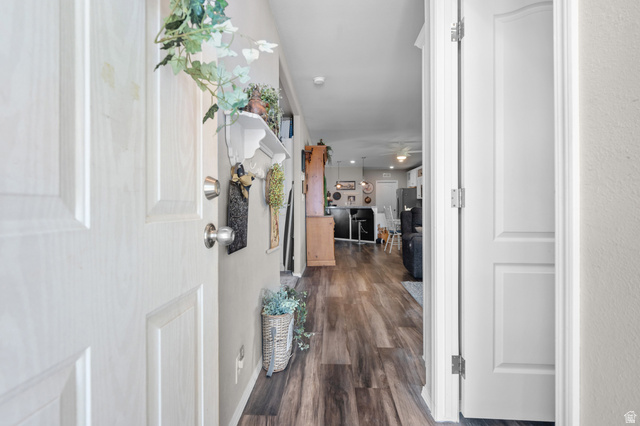 150 West 7500th South, Unit 13 Midvale, UT 84047 - Photo 2 of 32 Entryway featuring wood-finish flooring, white paneled doors, and a neutral wall color