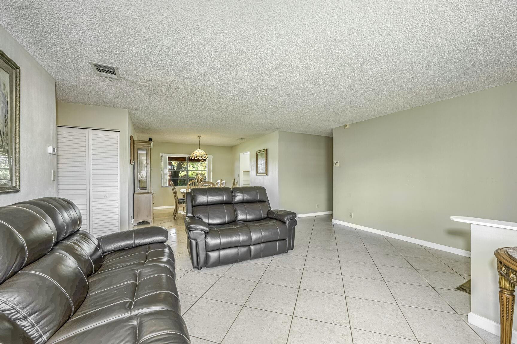 12630 Southwest 13th Manor Davie, FL 33325 - Photo 4 of 22 a living room with furniture