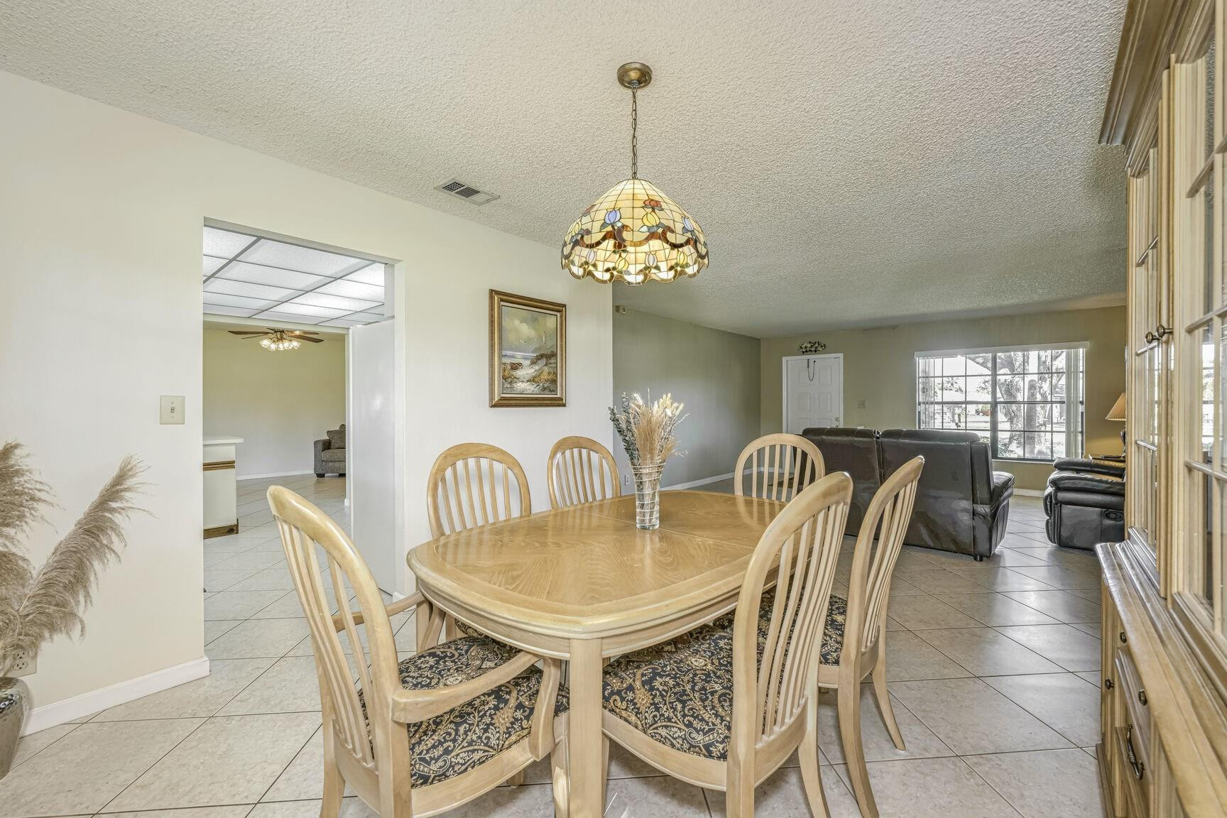 12630 Southwest 13th Manor Davie, FL 33325 - Photo 6 of 22 a dining room with furniture and window