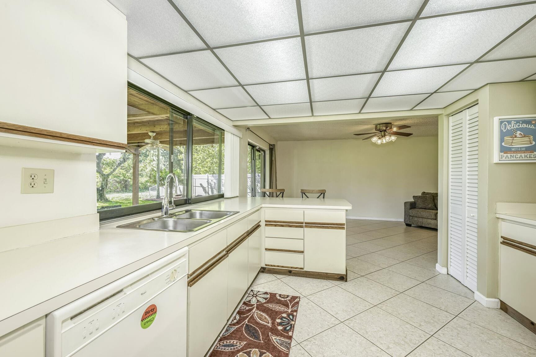 12630 Southwest 13th Manor Davie, FL 33325 - Photo 10 of 22 a kitchen with a sink and large cabinets