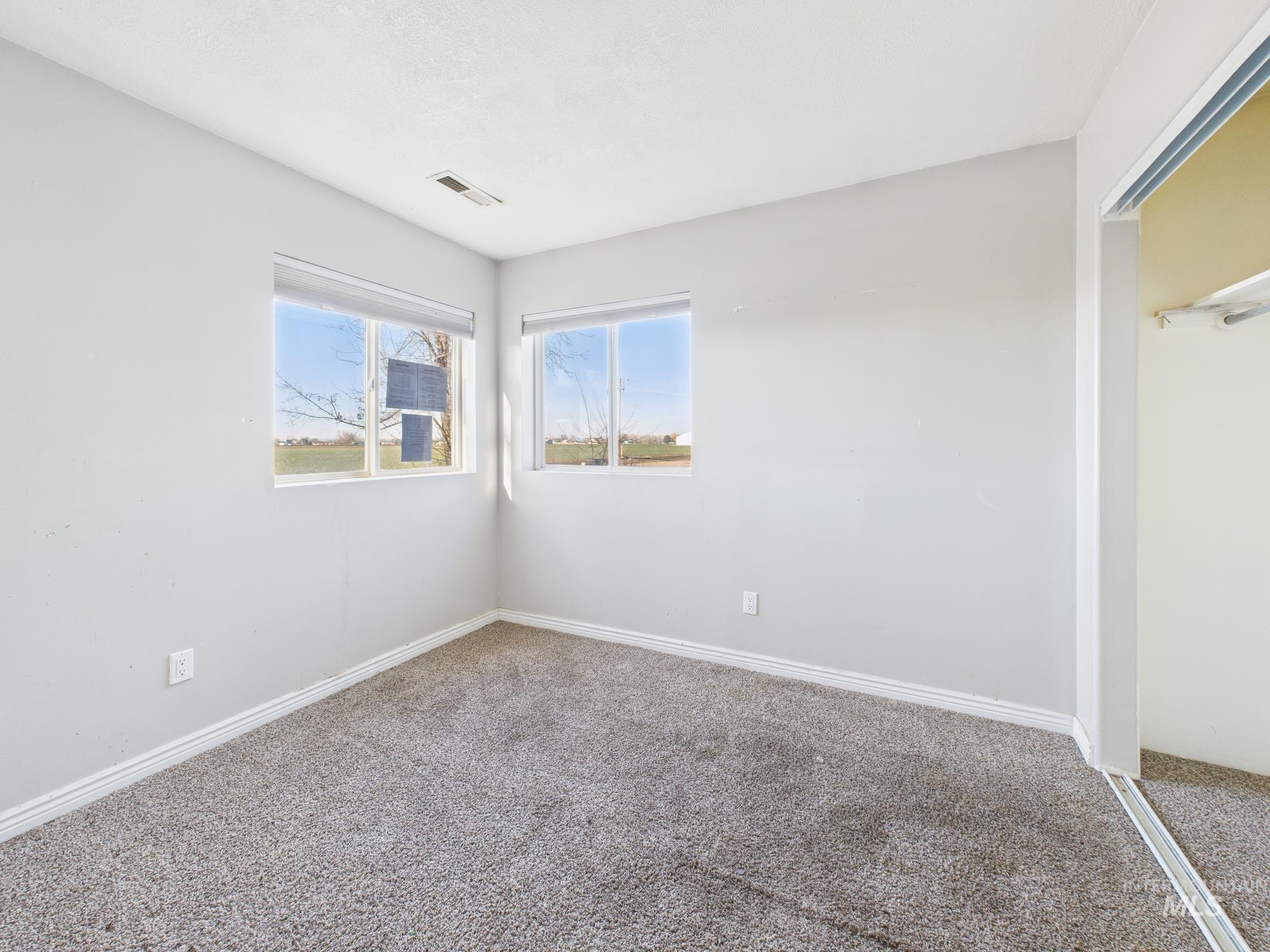 7352 Custer Road Fruitland, ID 83619 - Photo 17 of 43 Unfurnished bedroom with carpet floors and a closet