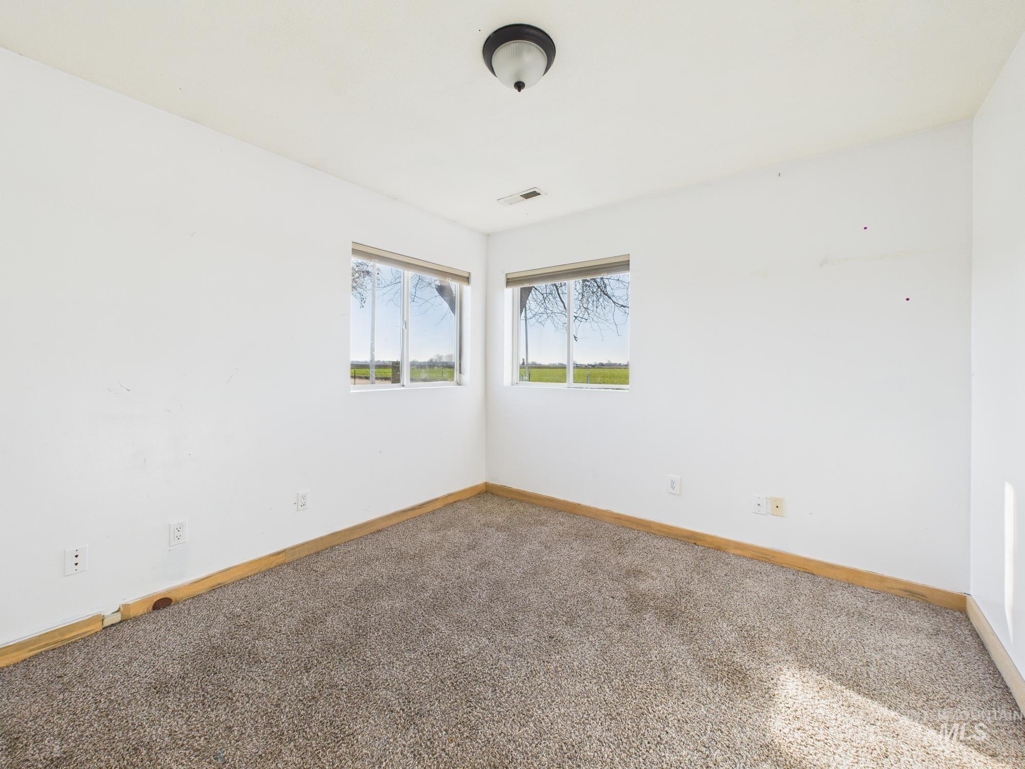 7352 Custer Road Fruitland, ID 83619 - Photo 20 of 43 Carpeted spare room with baseboards