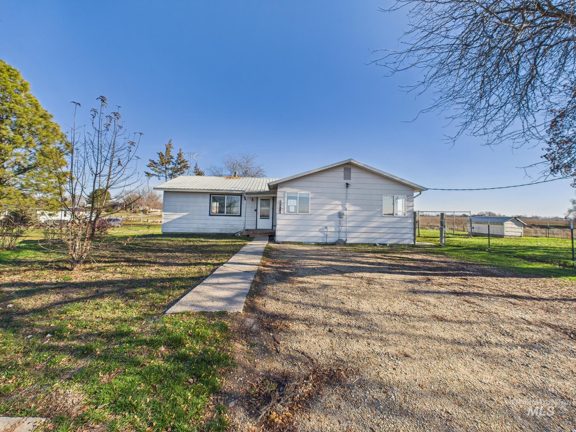 7352 Custer Road Fruitland, ID 83619 - Photo 2 of 43 View of front of house featuring a metal roof