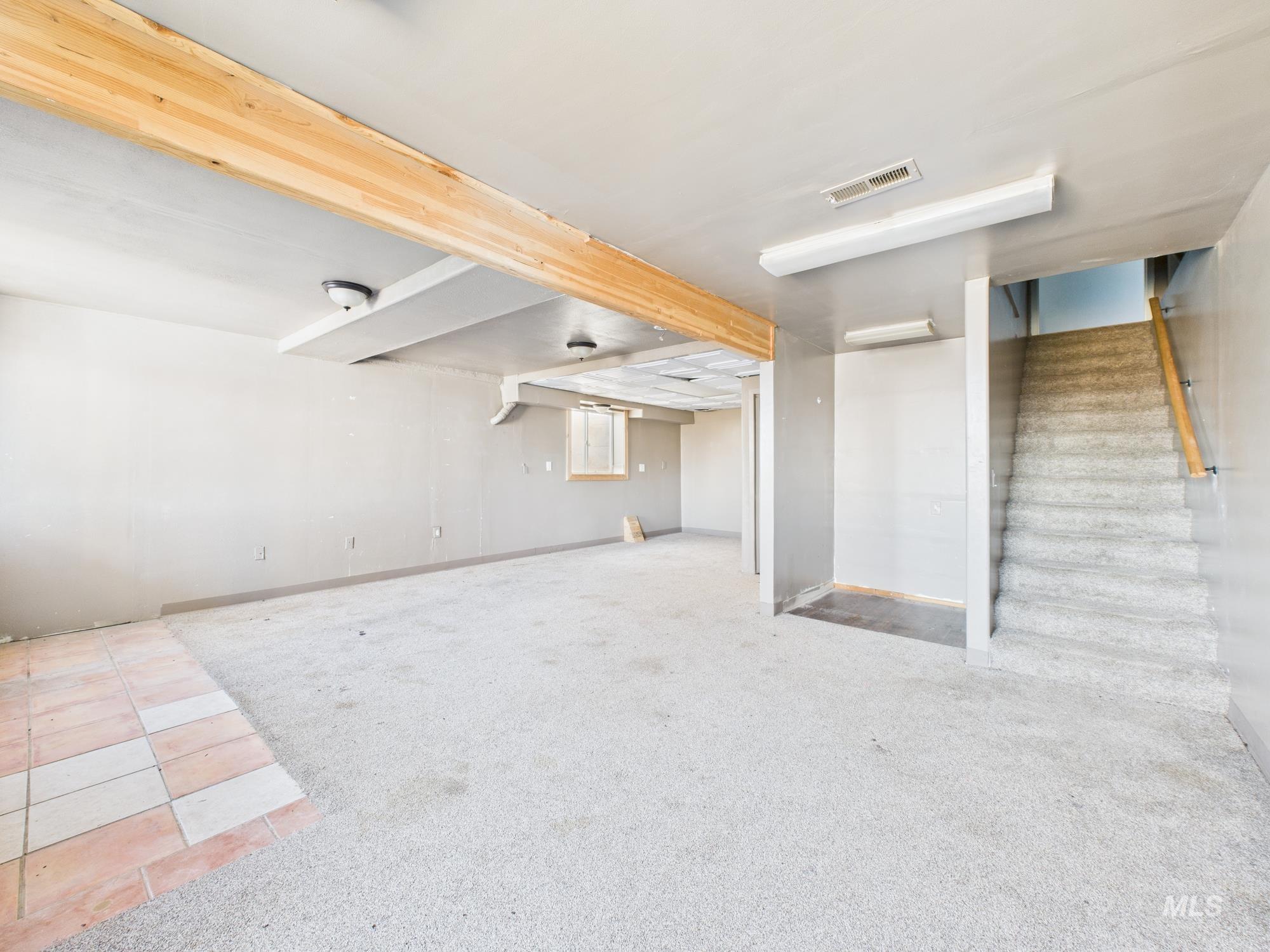 7352 Custer Road Fruitland, ID 83619 - Photo 25 of 43 Finished basement featuring carpet floors and stairway
