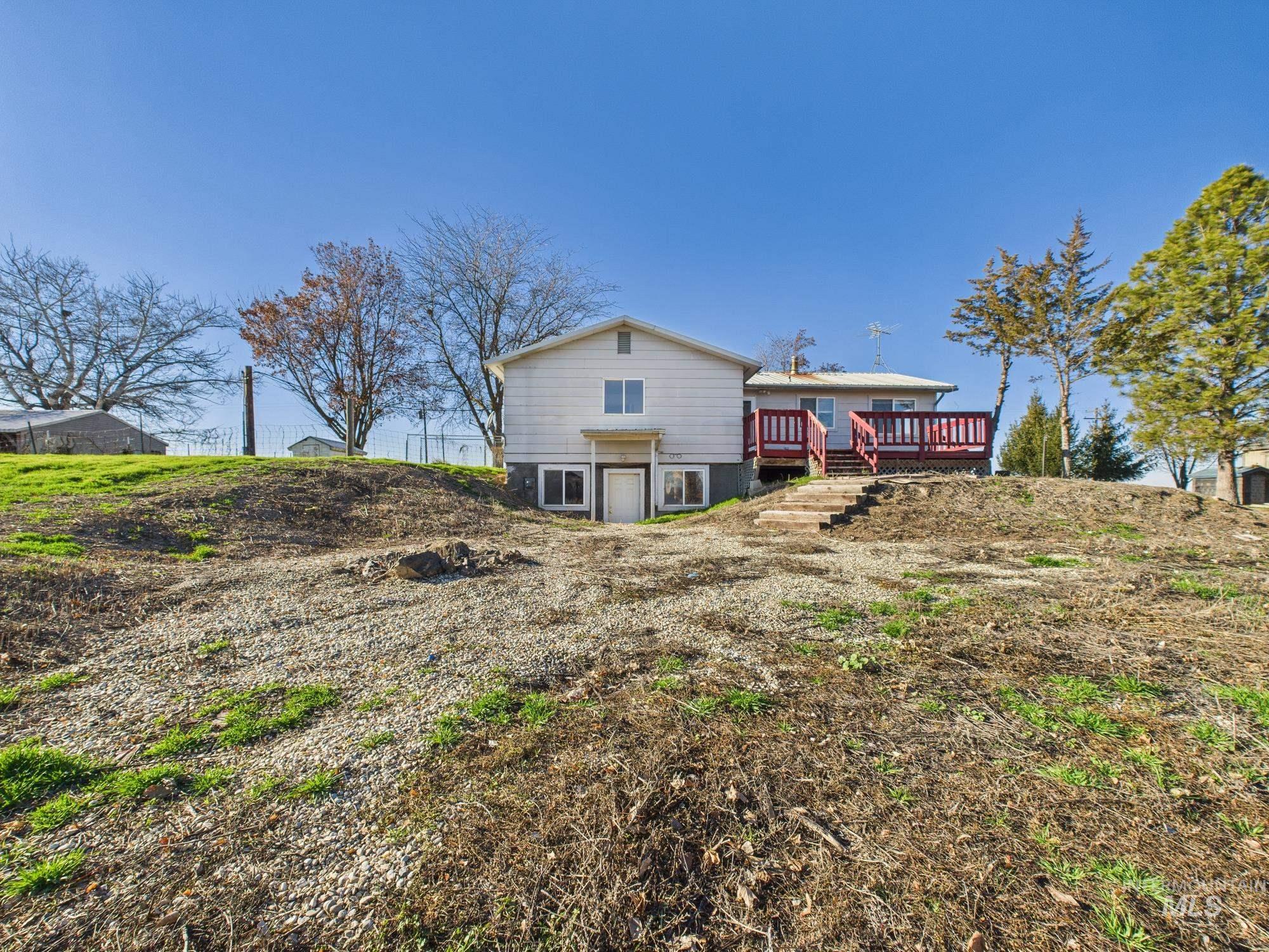 7352 Custer Road Fruitland, ID 83619 - Photo 29 of 43 Back of property featuring a wooden deck
