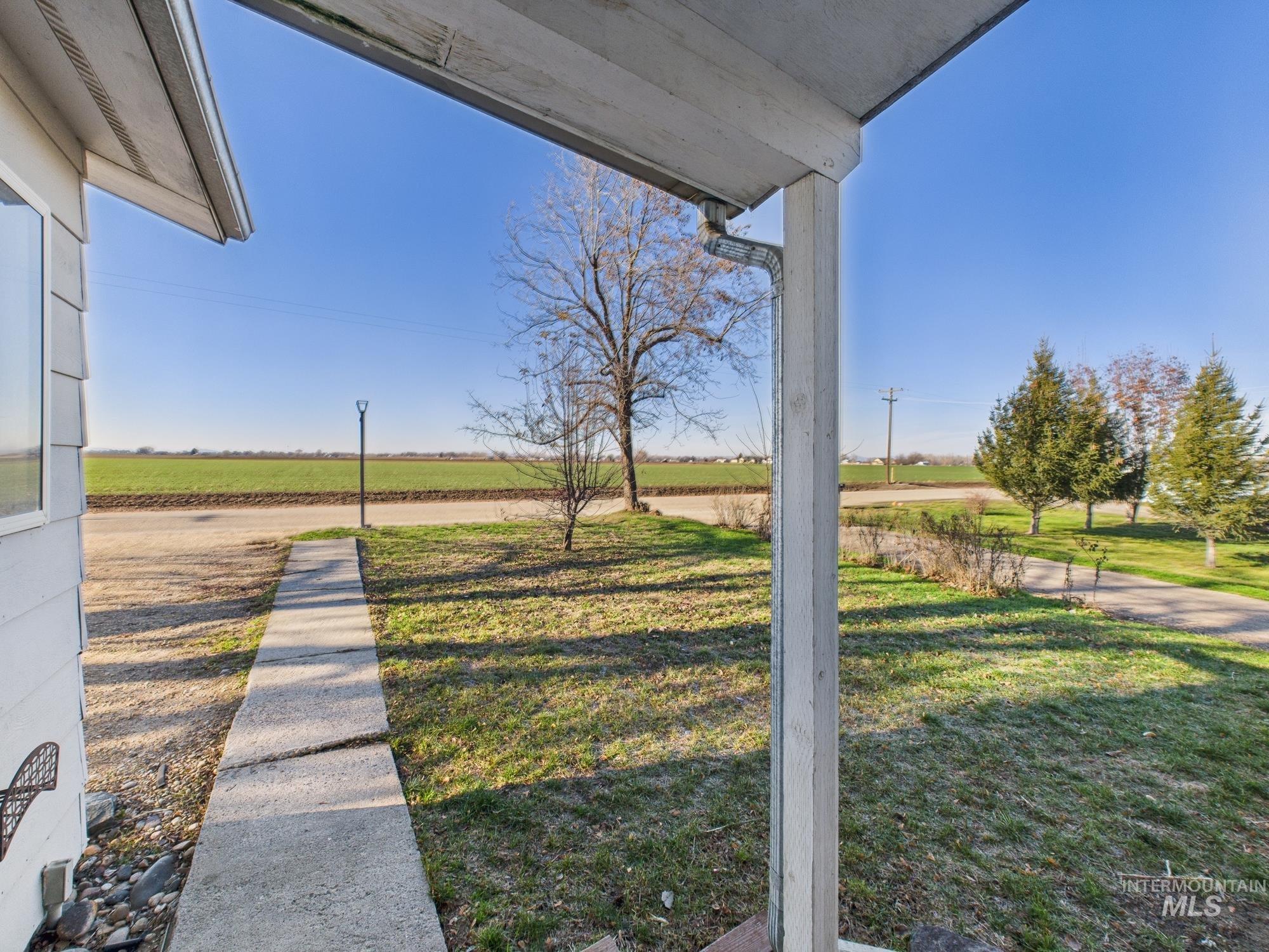 7352 Custer Road Fruitland, ID 83619 - Photo 38 of 43 View of grassy yard featuring a view of countryside and agricultural plots