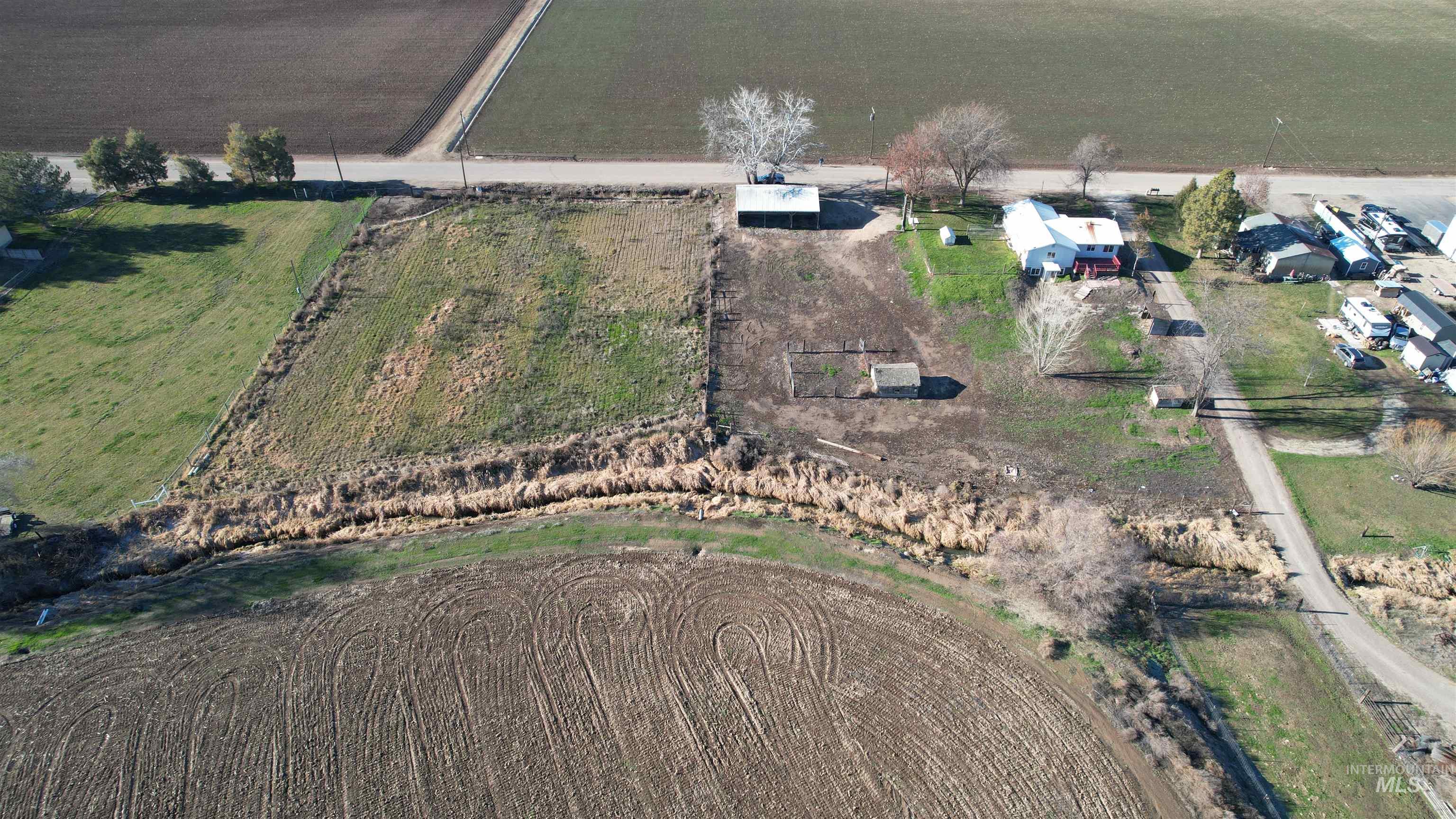 7352 Custer Road Fruitland, ID 83619 - Photo 40 of 43 Aerial view of property and surrounding area with rural landscape and farmland