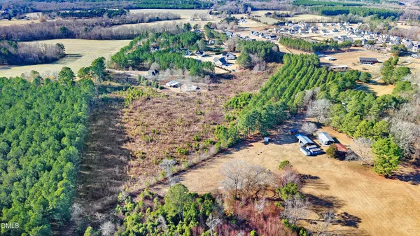 an aerial view of residential building and lake