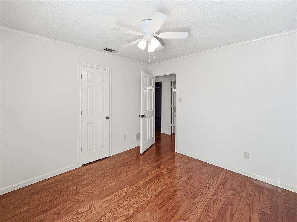 302 Apollo Road Garland, TX 75040 - Photo 19 of 38 a view of an empty room with wooden floor