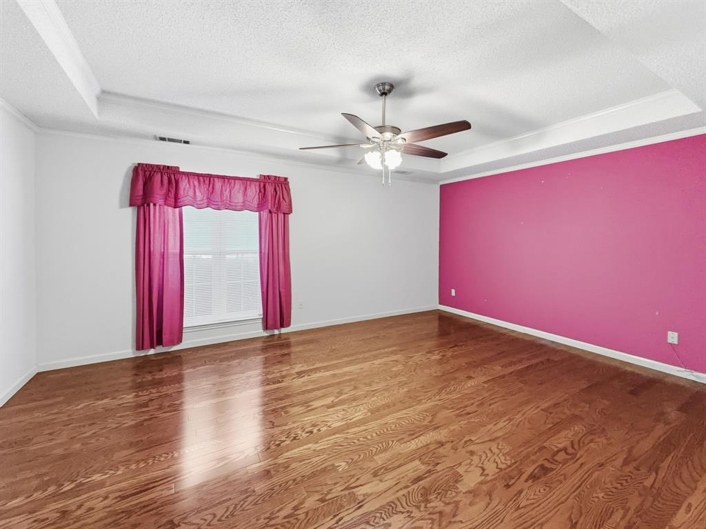 302 Apollo Road Garland, TX 75040 - Photo 20 of 38 a view of empty room with wooden floor and fan
