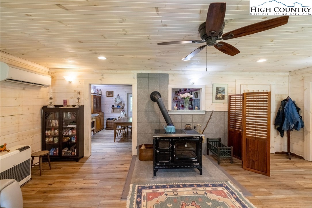 1369 Anderson Hill Road Lansing, NC 28643 - Photo 12 of 49 a dining room with furniture and wooden floor