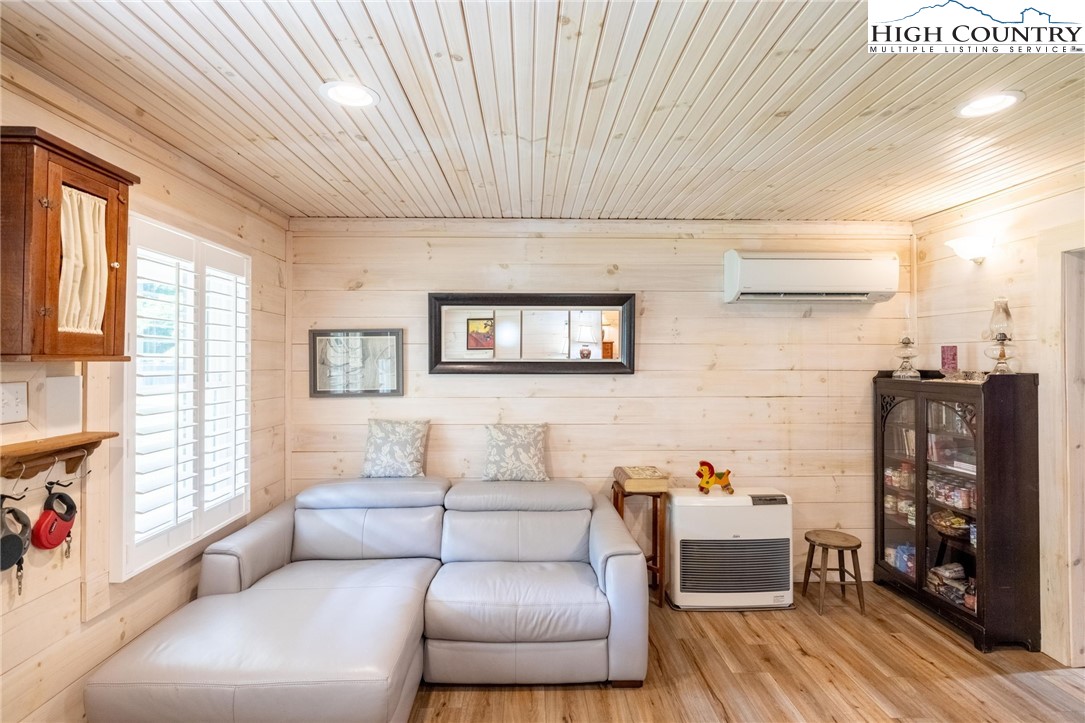 1369 Anderson Hill Road Lansing, NC 28643 - Photo 14 of 49 a living room with furniture and wooden floor