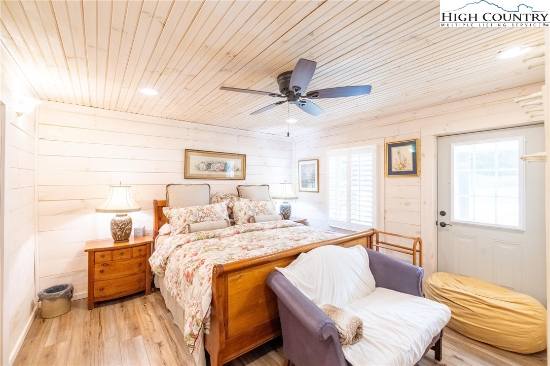 1369 Anderson Hill Road Lansing, NC 28643 - Photo 17 of 49 a bed room with a bed and a couch