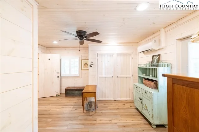 a kitchen with stainless steel appliances kitchen island granite countertop a refrigerator and a stove top oven