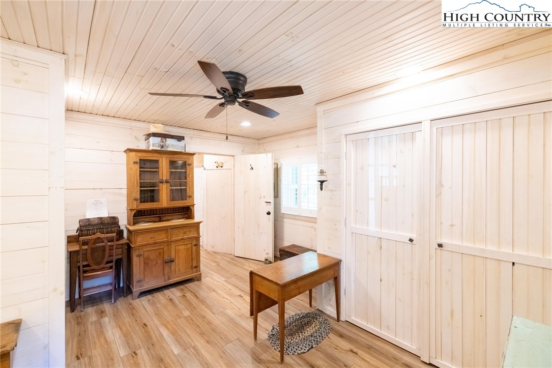 1369 Anderson Hill Road Lansing, NC 28643 - Photo 20 of 49 a living room with furniture a ceiling fan and a window