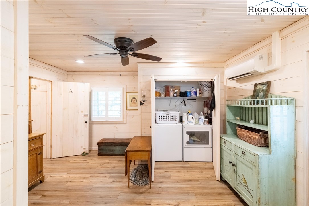 1369 Anderson Hill Road Lansing, NC 28643 - Photo 21 of 49 a kitchen with stainless steel appliances kitchen island granite countertop a refrigerator and microwave