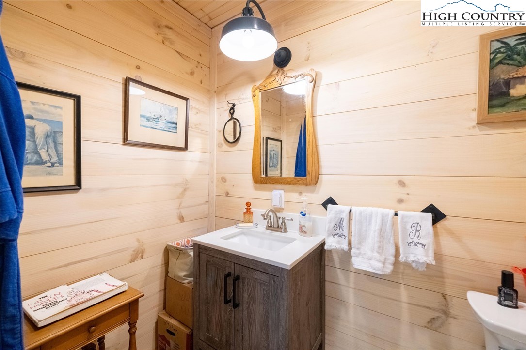 1369 Anderson Hill Road Lansing, NC 28643 - Photo 24 of 49 a bathroom with a sink and a mirror