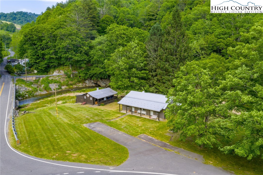 1369 Anderson Hill Road Lansing, NC 28643 - Photo 3 of 49 a view of a swimming pool with a sitting area