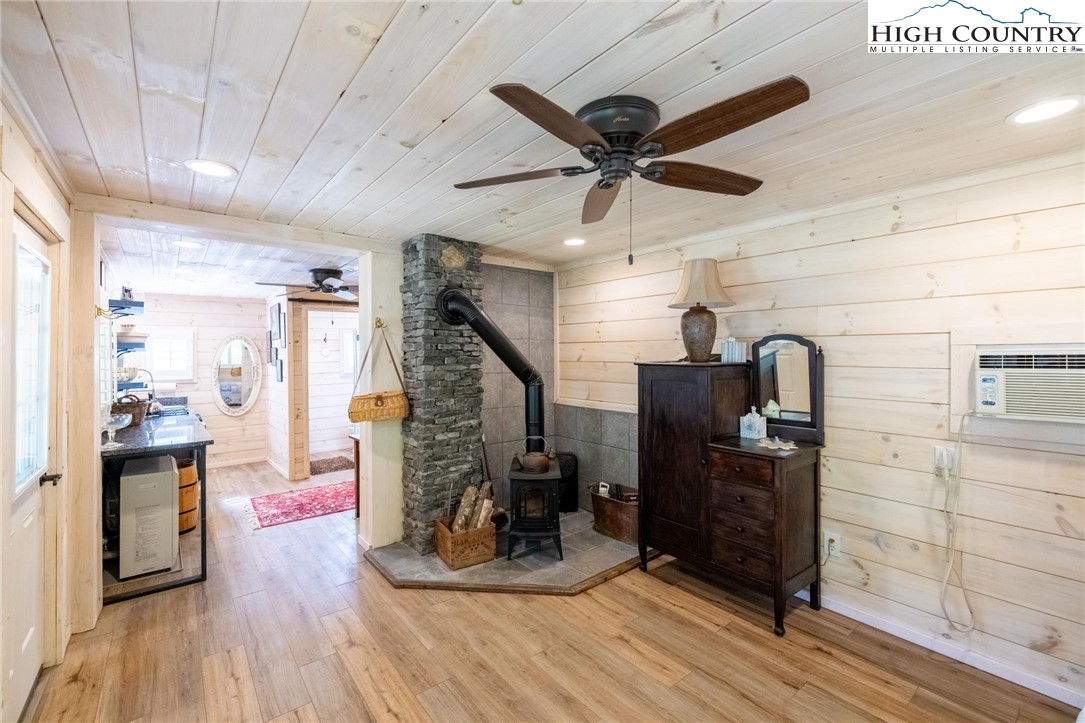 1369 Anderson Hill Road Lansing, NC 28643 - Photo 34 of 49 a view of a hallway with wooden floor and staircase