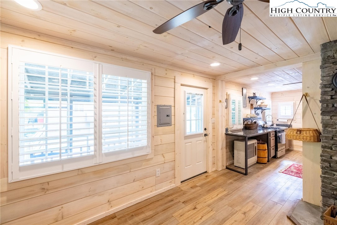 1369 Anderson Hill Road Lansing, NC 28643 - Photo 35 of 49 a view of a livingroom with furniture hardwood floor and workspace