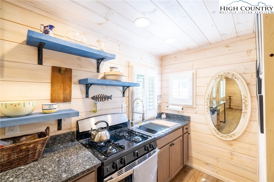 1369 Anderson Hill Road Lansing, NC 28643 - Photo 38 of 49 a kitchen with a stove and a sink