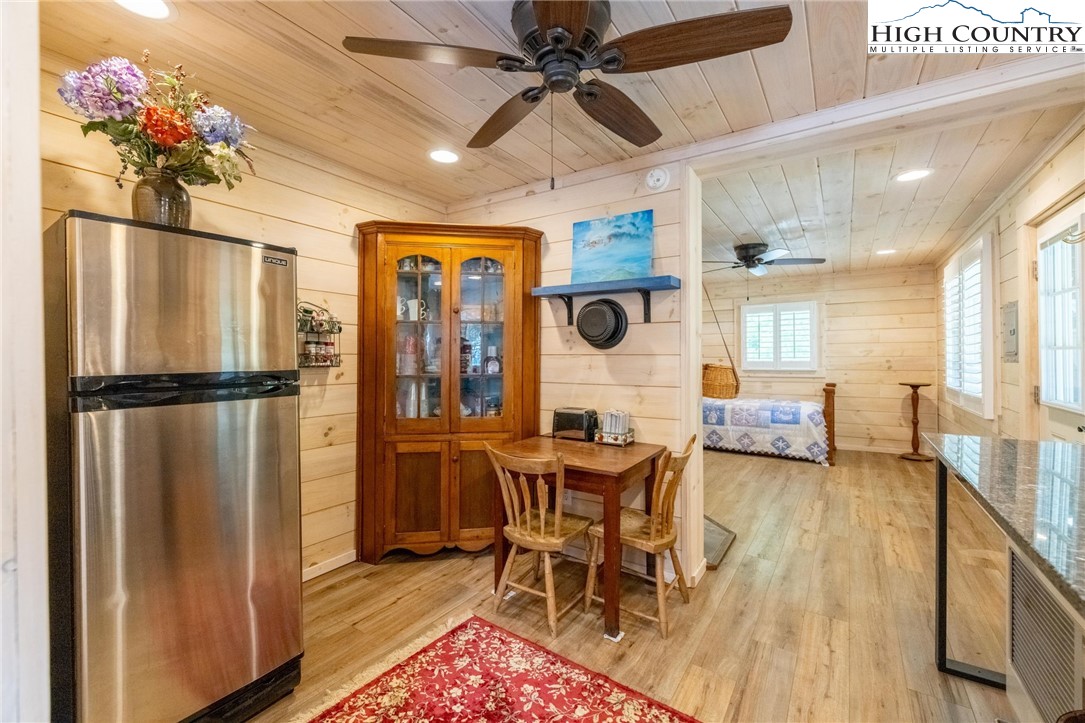 1369 Anderson Hill Road Lansing, NC 28643 - Photo 39 of 49 a view of a dining room with furniture window and wooden floor