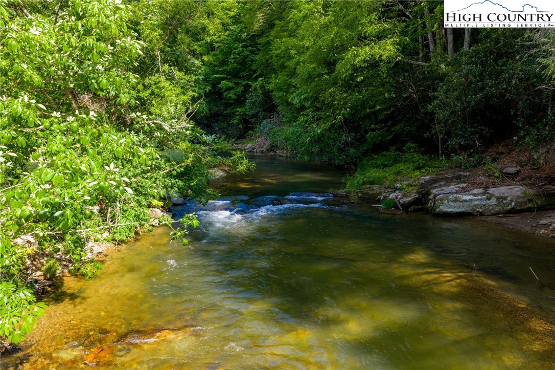 1369 Anderson Hill Road Lansing, NC 28643 - Photo 4 of 49 a view of a lake with houses