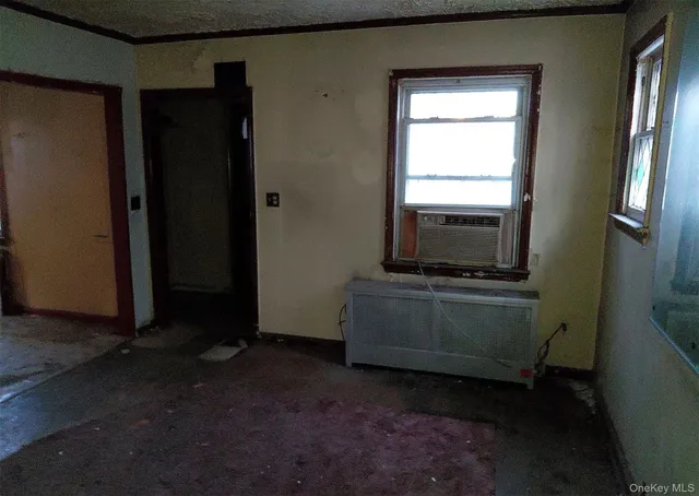 a room with window and a mirror