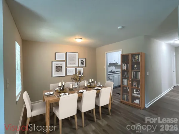 a dining room with furniture and window