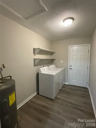 a utility room with washer and dryer