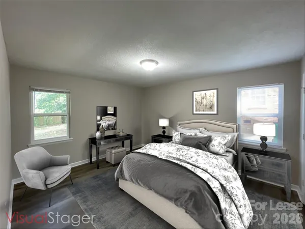 a bedroom with a bed and a couch