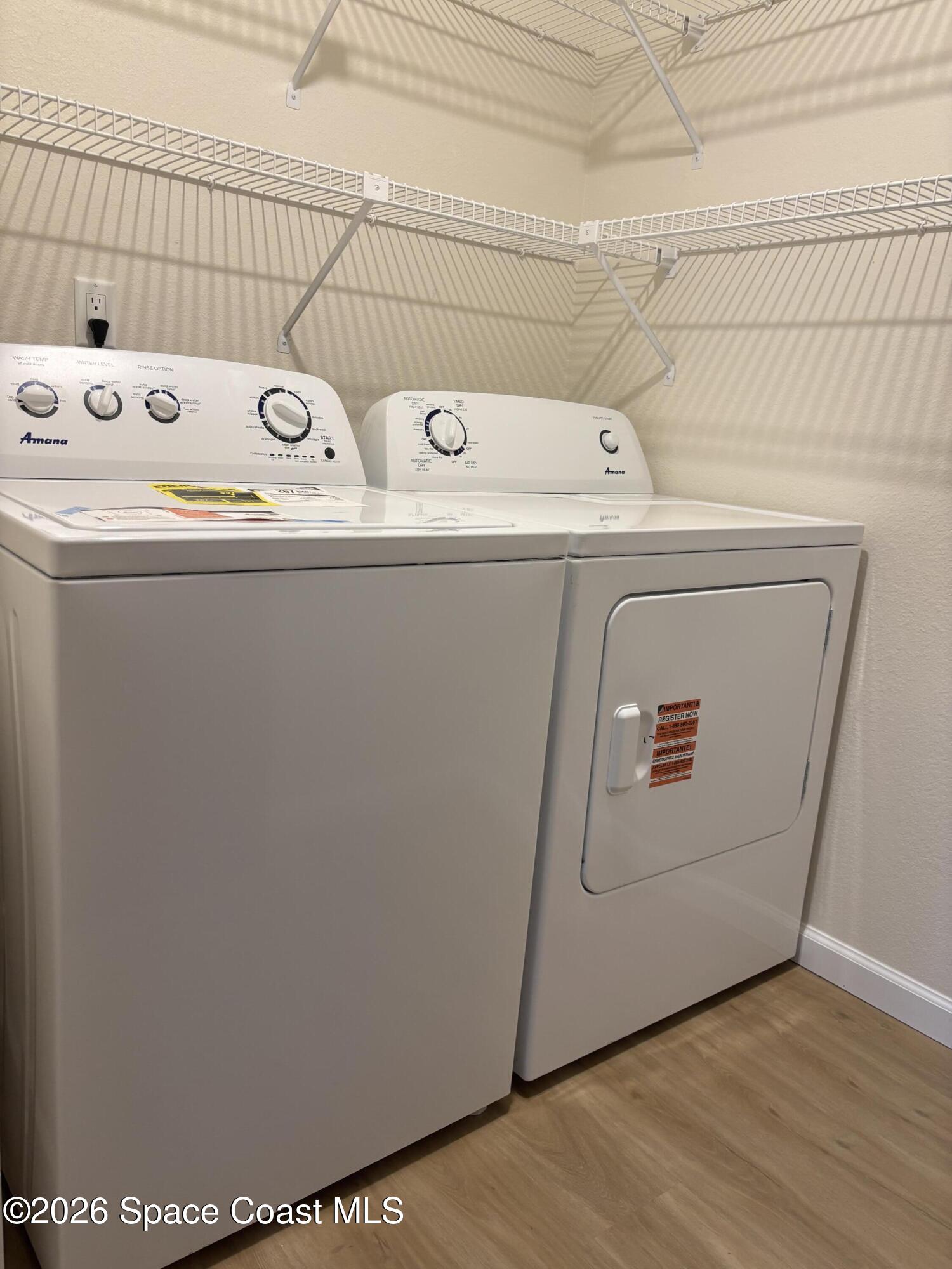 1882 Murrell Road, Unit J36 Rockledge, FL 32955 - Photo 13 of 24 a utility room with dryer and washer
