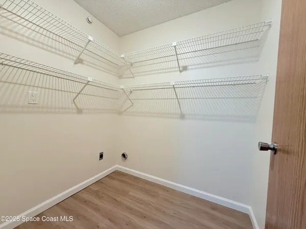 a view of a room with racks on the wall