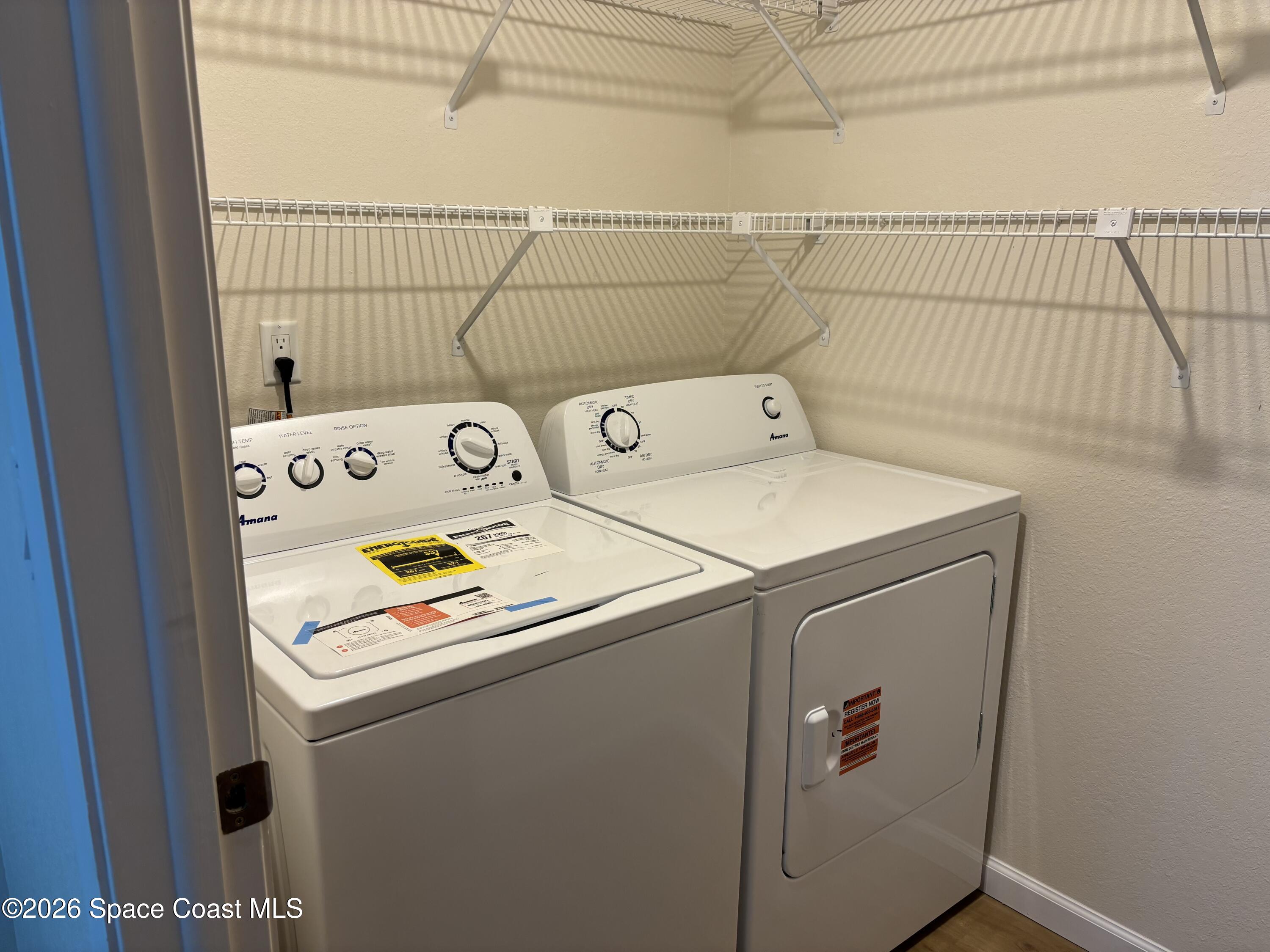 1882 Murrell Road, Unit J36 Rockledge, FL 32955 - Photo 14 of 24 a utility room with dryer and washer