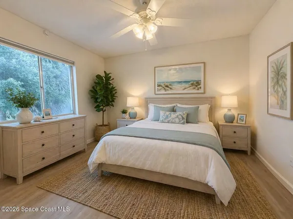a bedroom with a large bed and a window