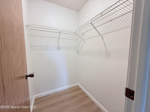 a view of a room with racks on the wall