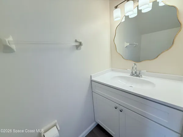 a bathroom with a sink and mirror